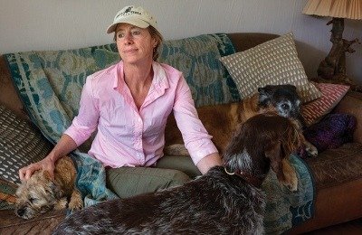 Megan Parker and her dogs Winston, Mr. Smith (standing) and Pepin. Photo by By Louise Johns