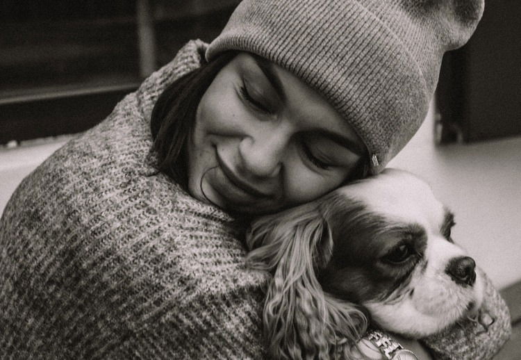 dog and woman hug